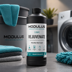 Rejuvenate microfibre wash liquid bottle beside clean detailing towels