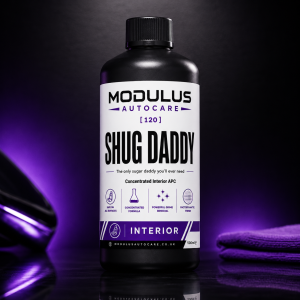 Shug Daddy interior APC bottle inside a car interior with purple lighting